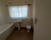 combined tub and toilet