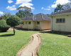 This is the back view of the property, showing part of the house and the back door area This is the back view of the property, showing part of the house and the back door area