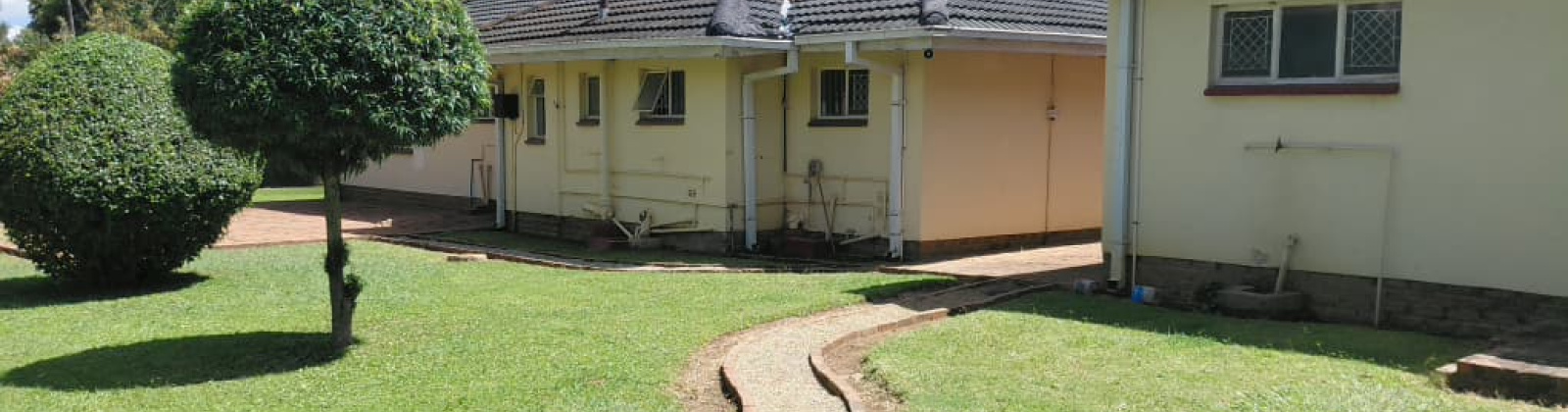 This is the back view of the property, showing part of the house and the back door area This is the back view of the property, showing part of the house and the back door area